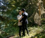 gay wedding couple hugging in the forest in whistler