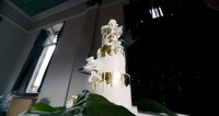 white with gold trim wedding cake
