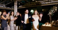 wedding couple enjoy their grand entrance at the ace hotel