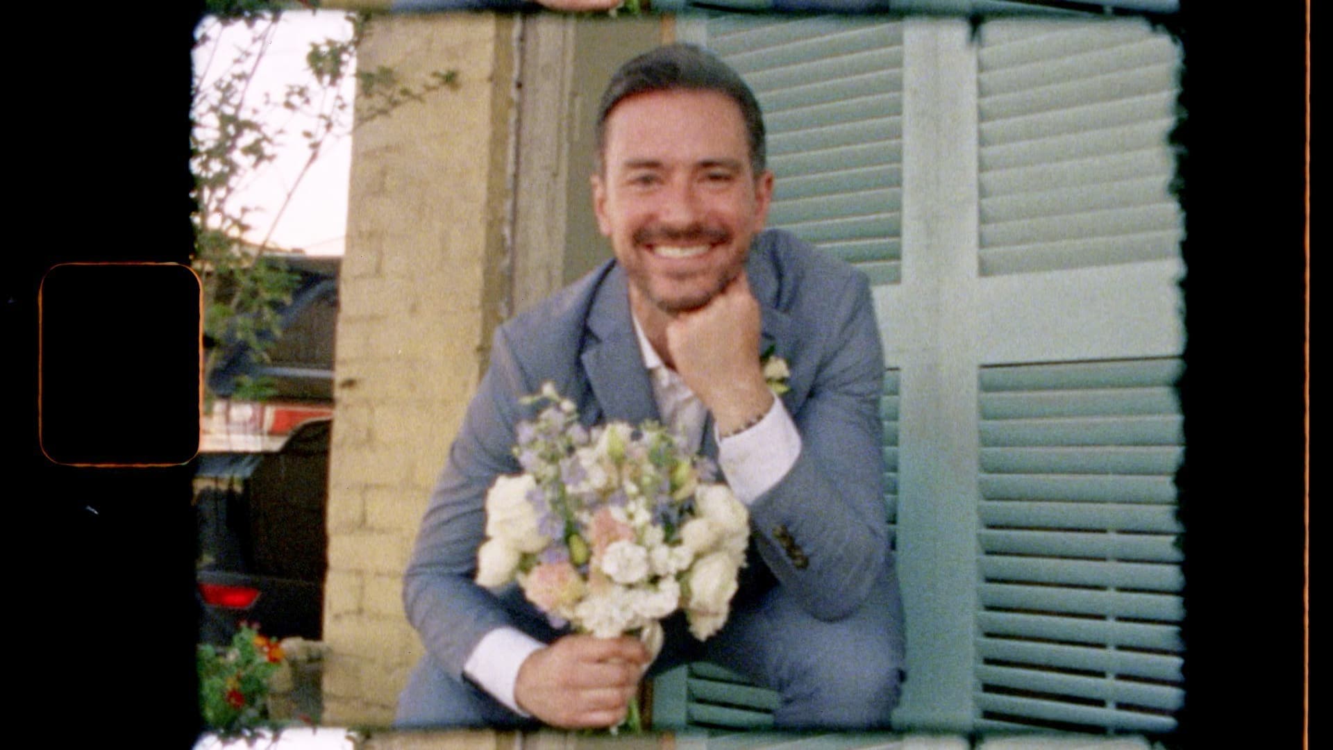 groom holding bouquet on super 8mm film