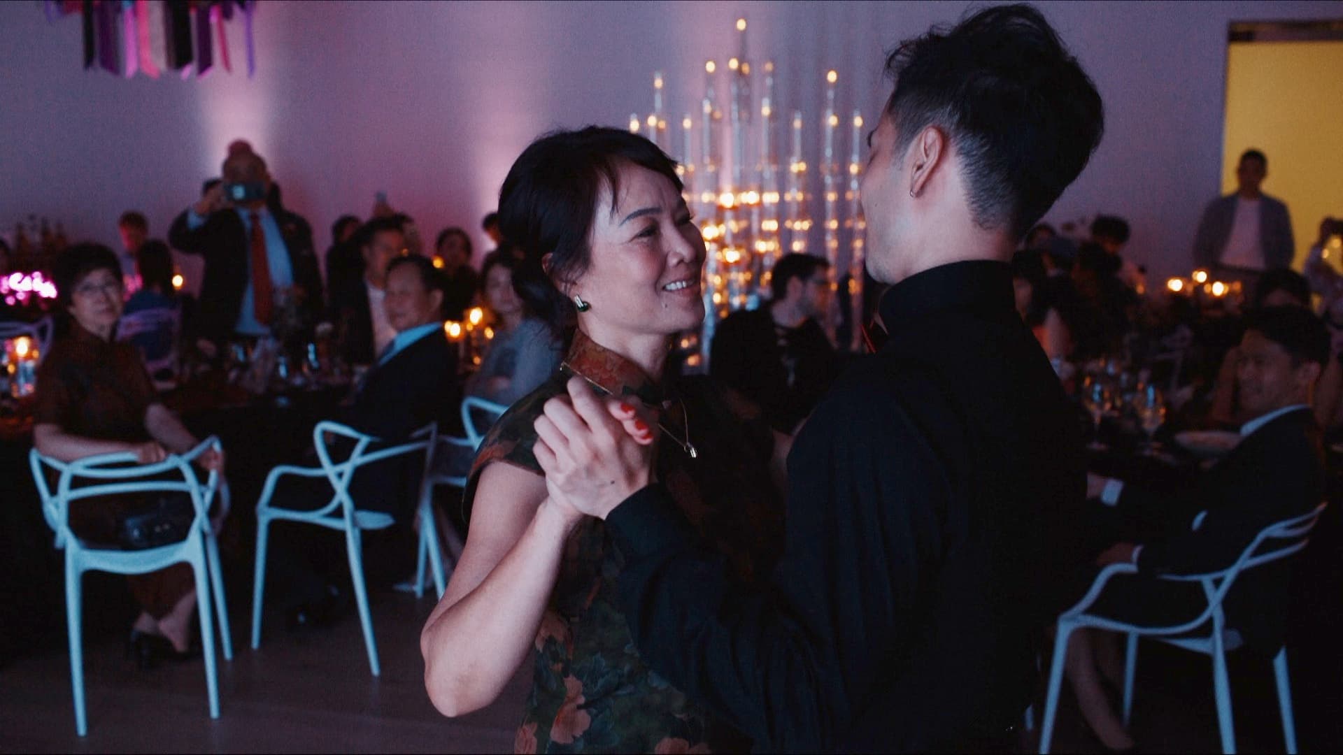 chinese groom dancing with his mom after first dance