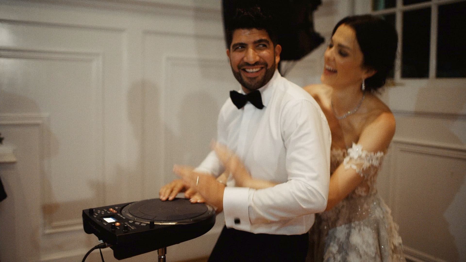 groom and bride playing electronic drum