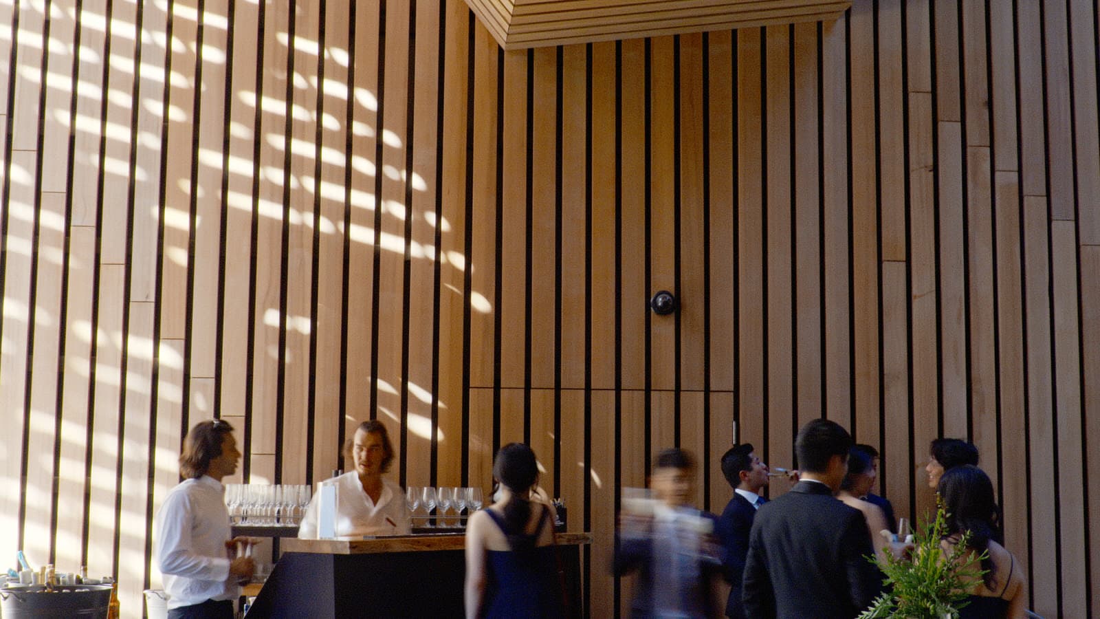 guests enjoying drinks in the atrium of the audain art museum