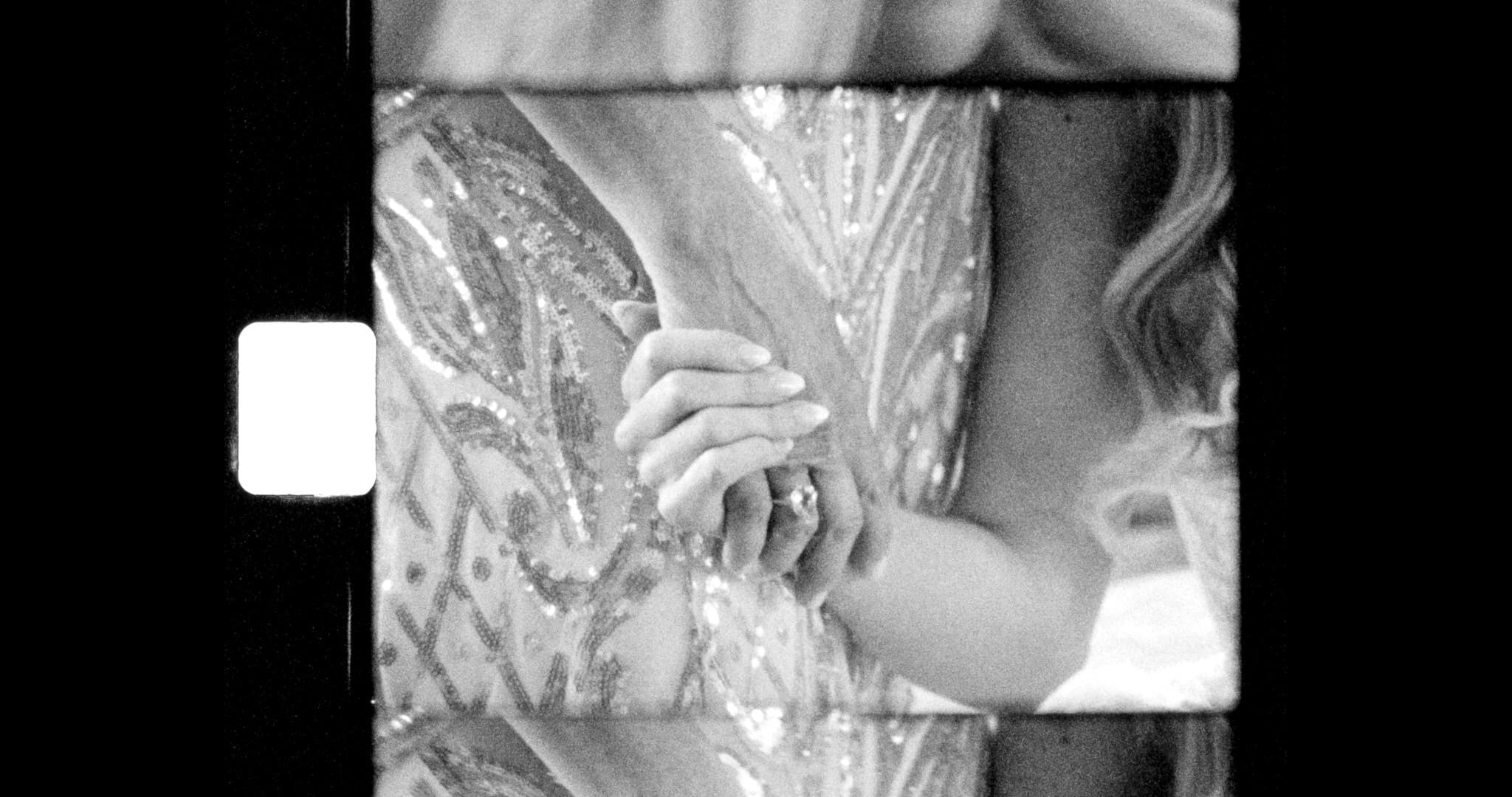 mother holding daughter's hand on super 8mm film