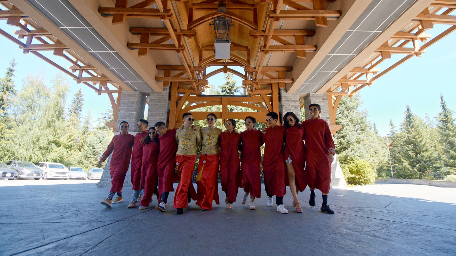 gay wedding couple and their wedding party wearing traditional chinese clothing