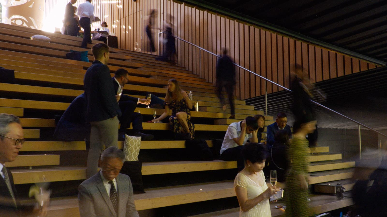 guests sitting on the grand staircase at the audain art museum