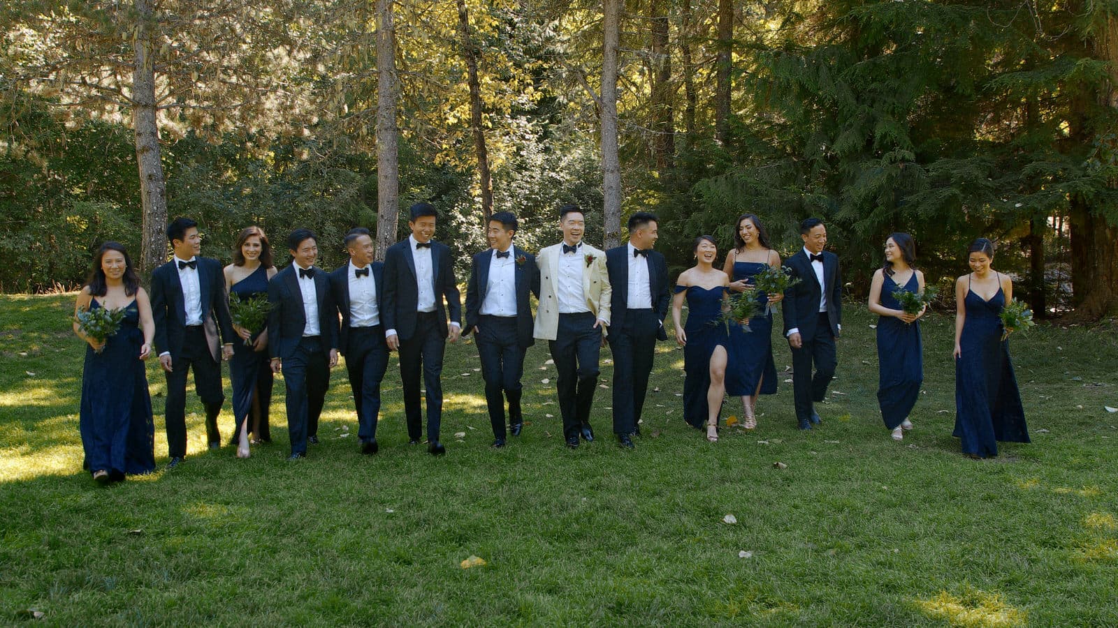 gay wedding couple with their wedding party