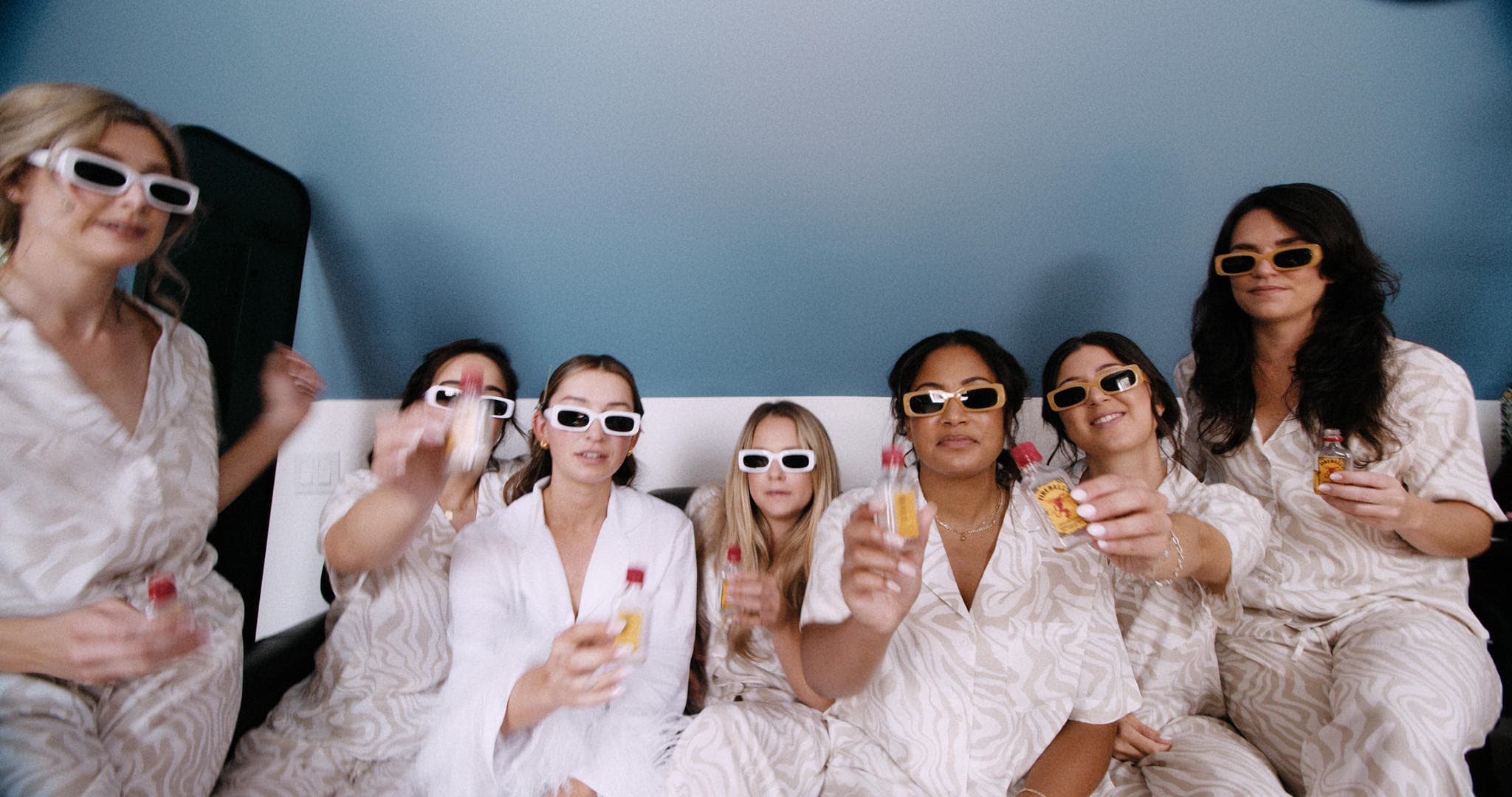 bride and bridesmaids wearing sunglasses