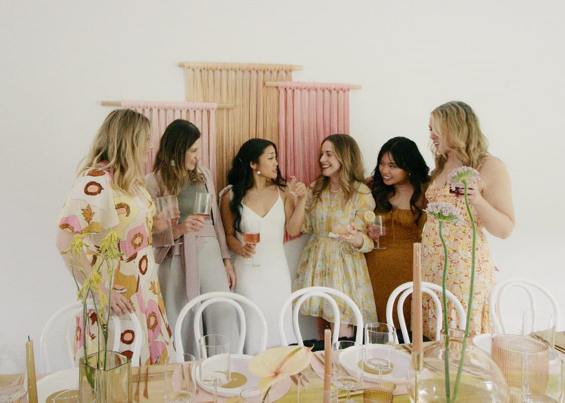 bride and bridesmaids enjoying a moment together