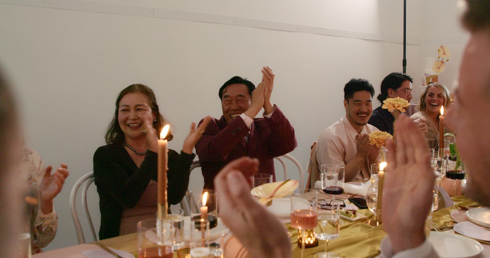 wedding guests cheering on the bride and groom