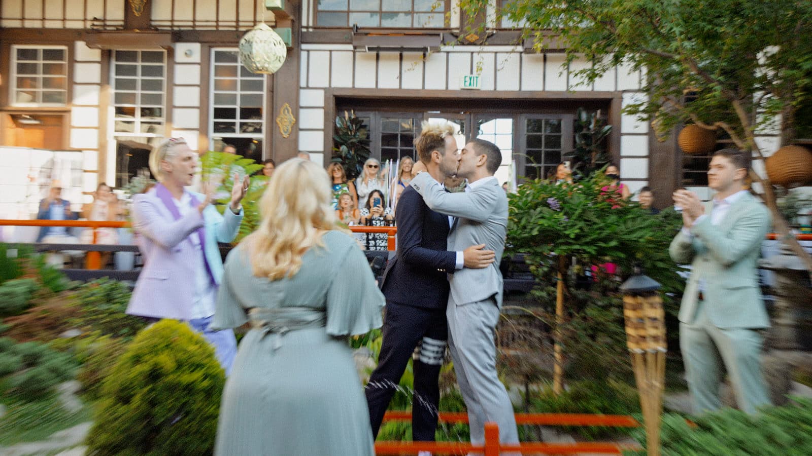 two married men kissing at their wedding ceremony at yamashiro in LA