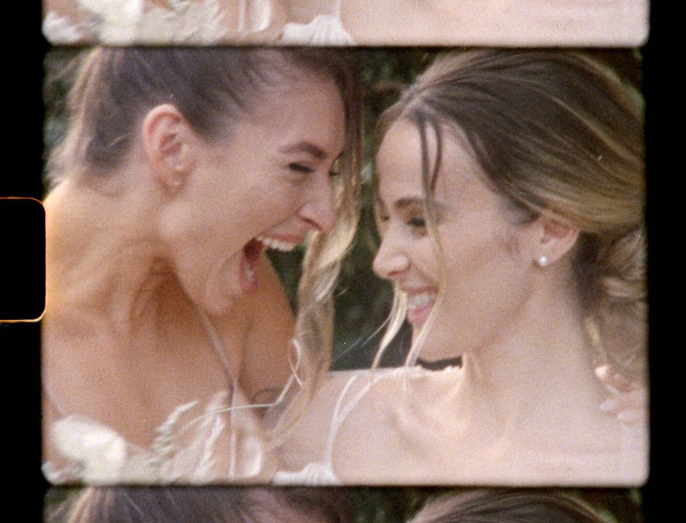super 8mm film still of happy bride and bridesmaid