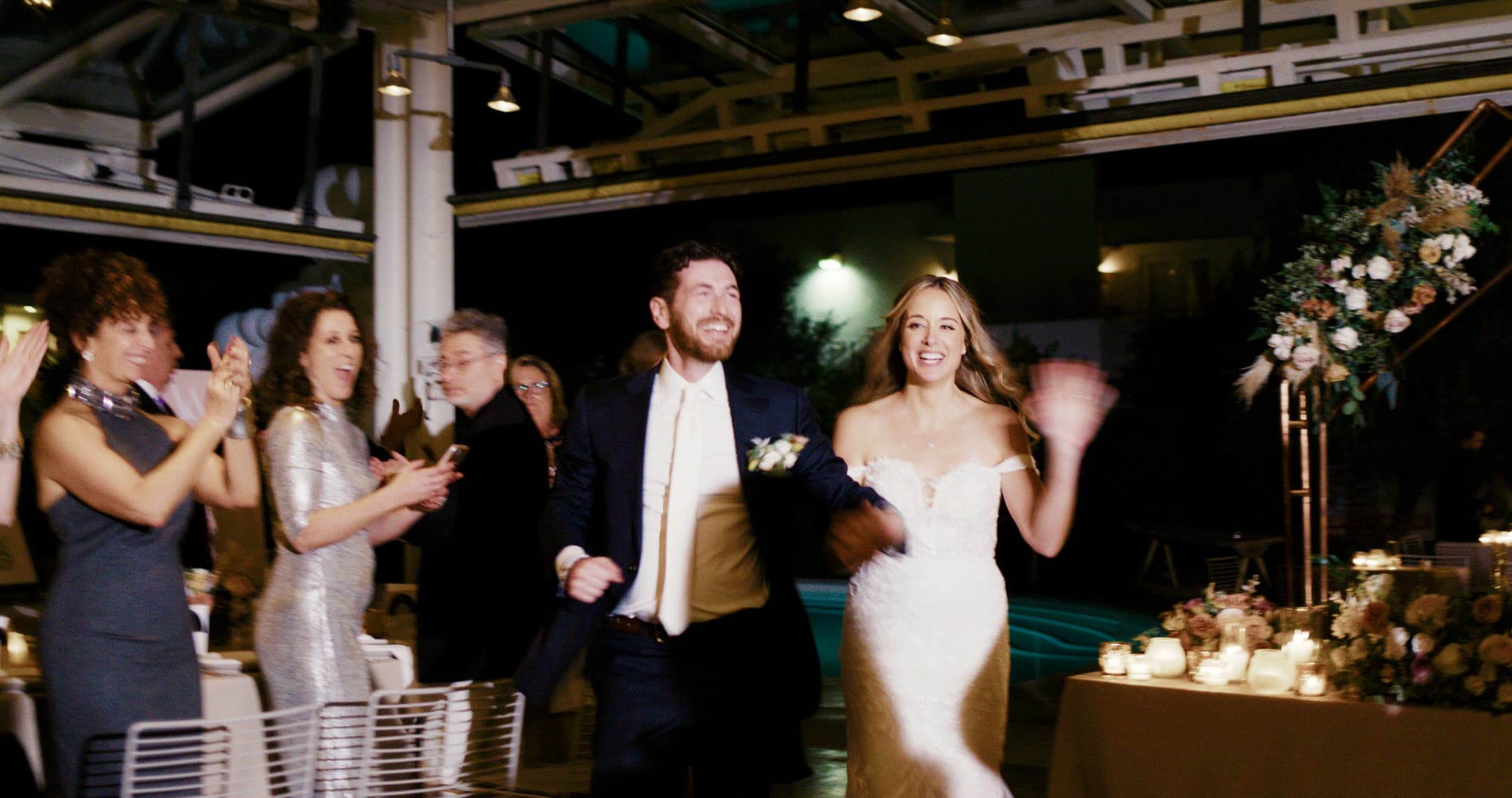 wedding couple enjoy their grand entrance at the ace hotel