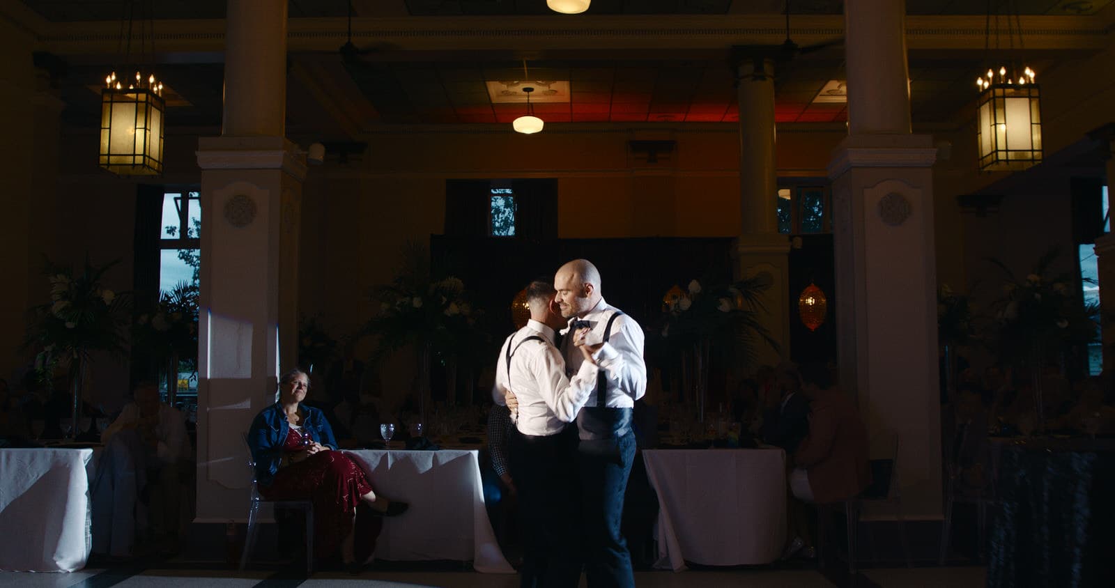 gay couple dancing at heritage hall on their wedding day